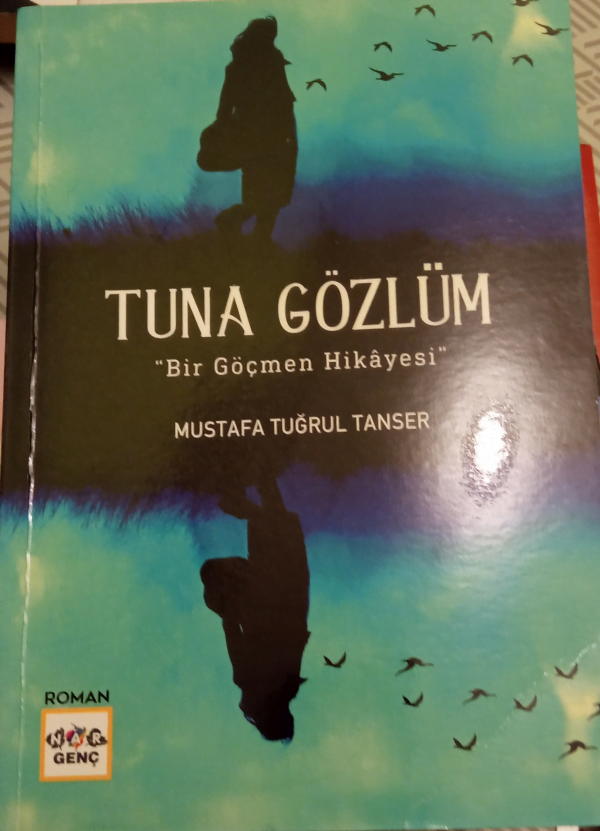 TUNA GÖZLÜM "Bir Göçmen Hikayesi"/Mustafa Tuğrul TANSER